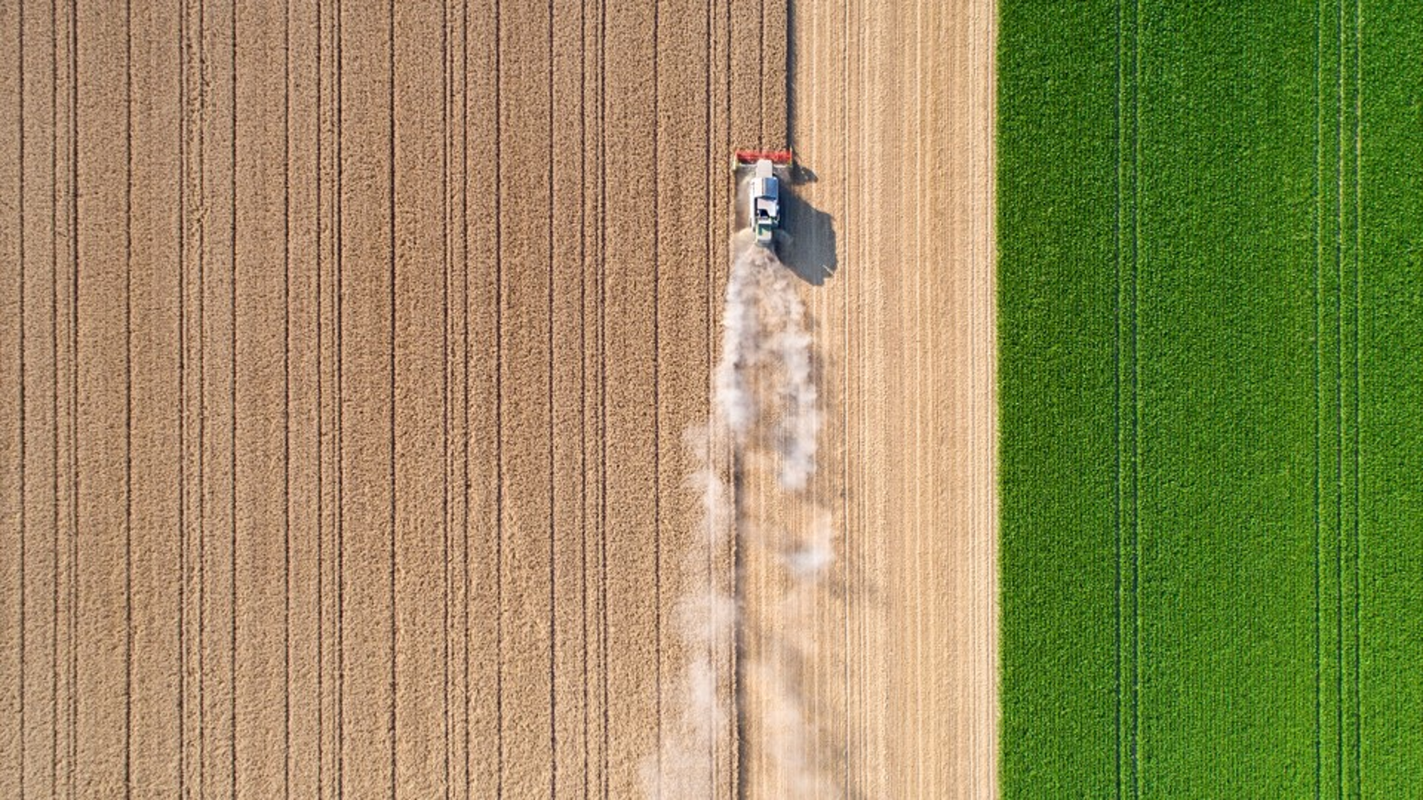 Aerial photograph showing a farming tractor in a farm field.
